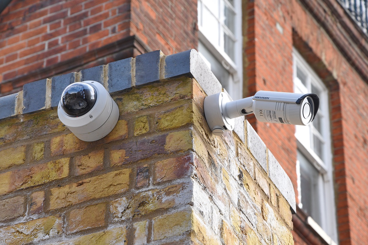 Outdoor surveillance cameras mounted on brick wall